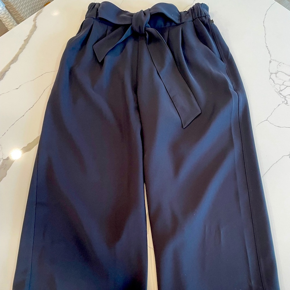 Cropped and belted black wide leg Lululemon pants